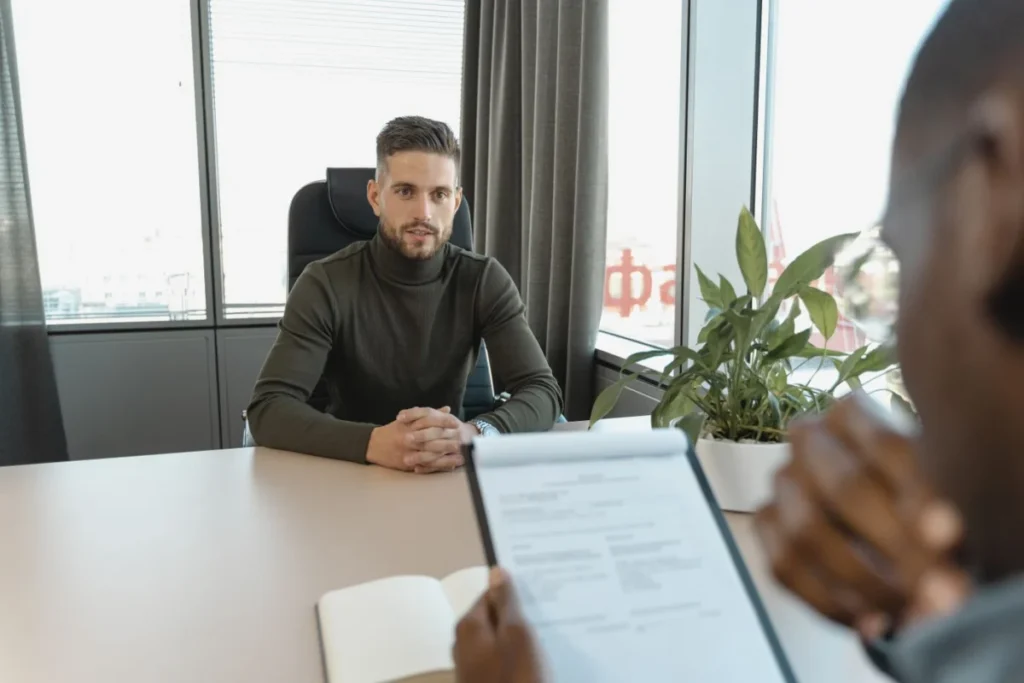 Professional man at an office desk during a job interview