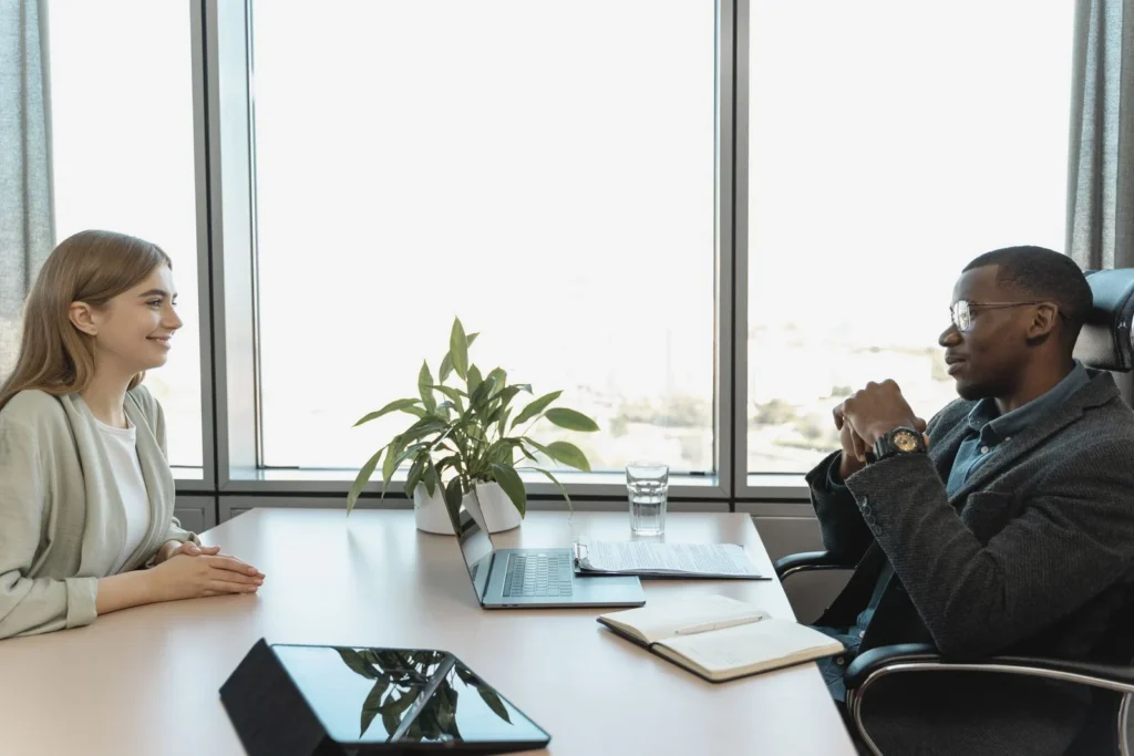 Engaging job interview between two colleagues in a bright, modern office