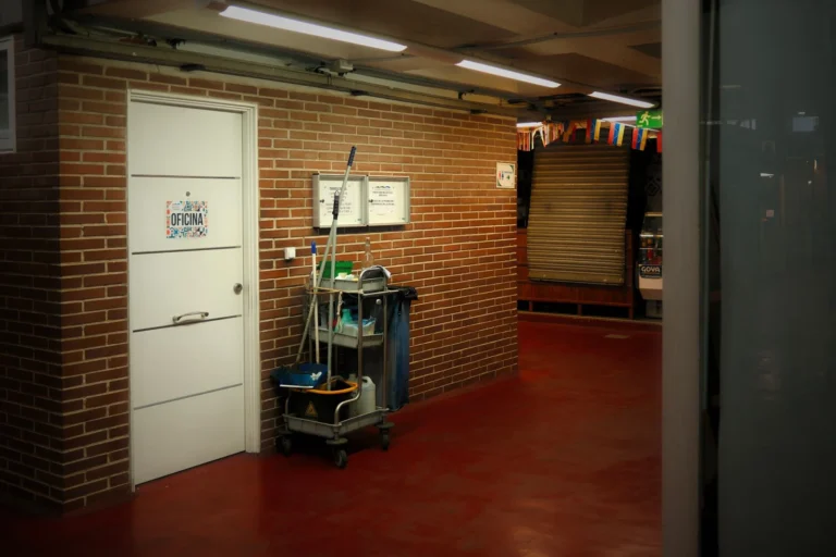 Cleaning cart and supplies in a hallway, ready for custodian jobs