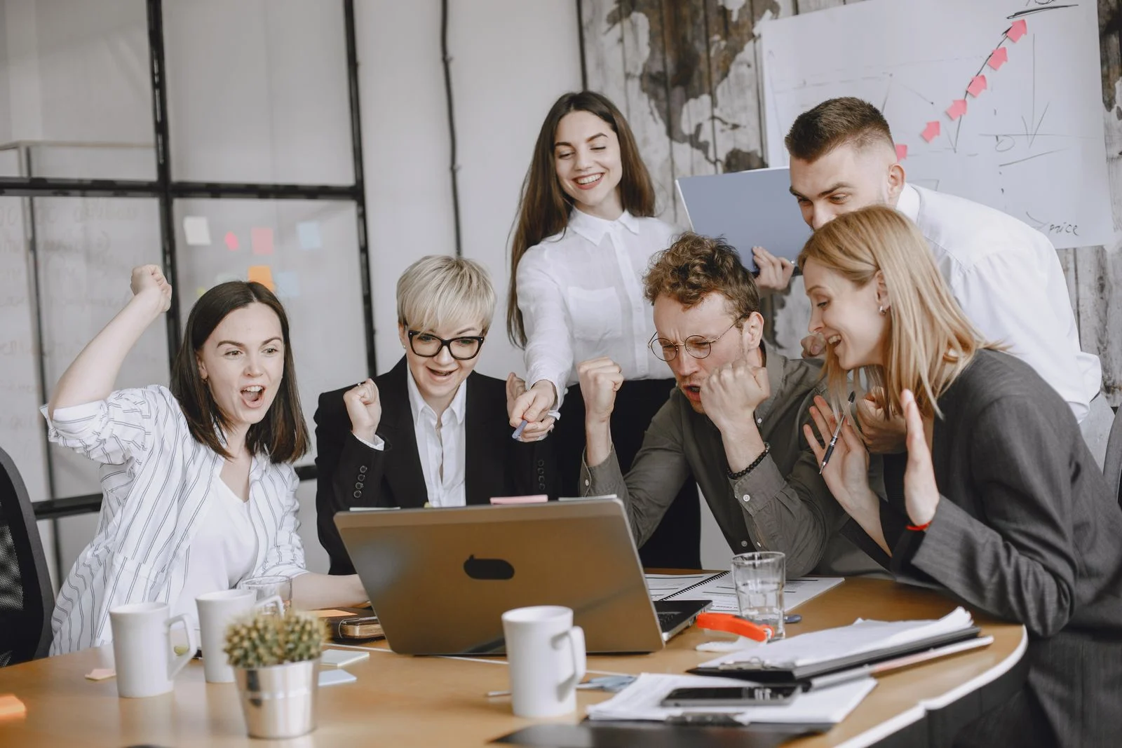 Coworkers celebrating together, a result of good employee retention