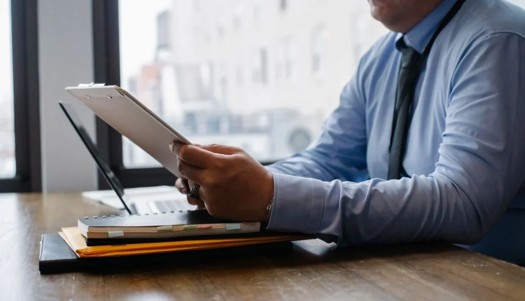 Focused businessman analyzing reports in a modern office setting
