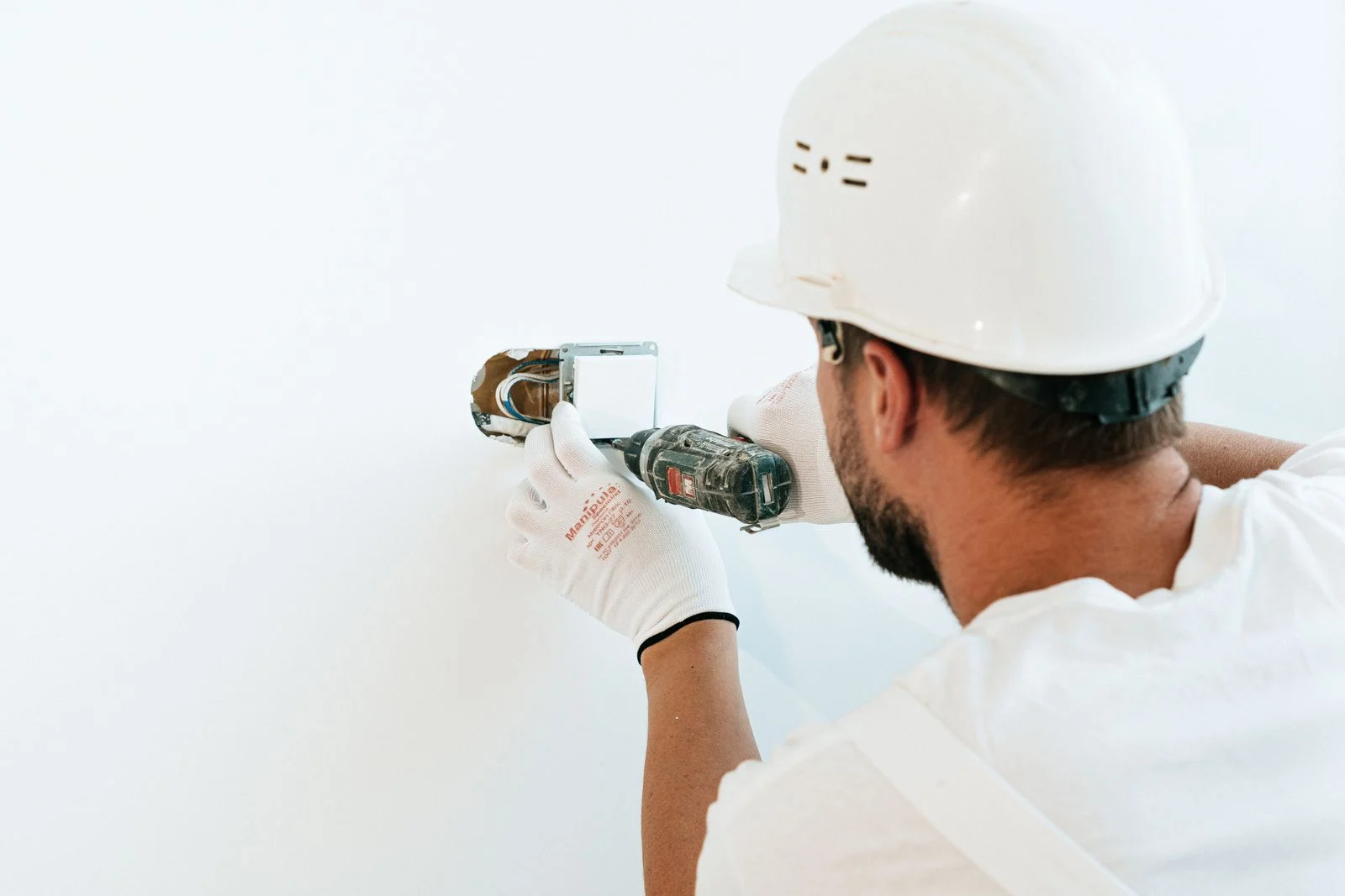 Worker repairing pipes, a common task in maintenance technician jobs