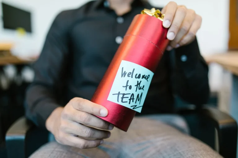 Team welcoming a new employee after temp to hire jobs turn permanent